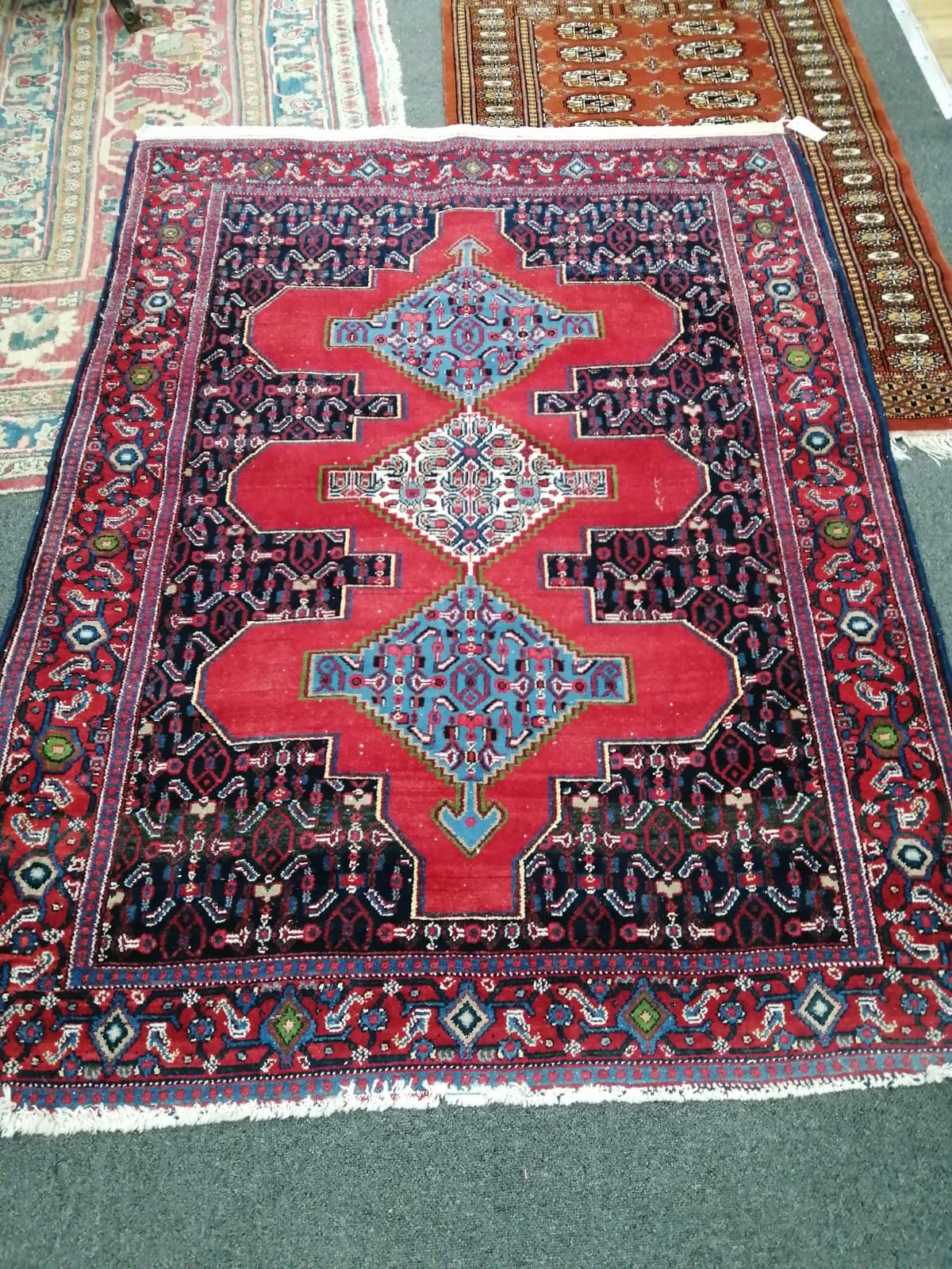A North West Persian red ground rug, 156 x 120cm